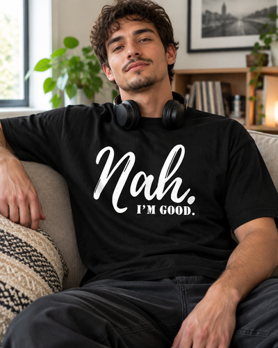 Man relaxing on a couch wearing the Nah I'm Good graphic tee