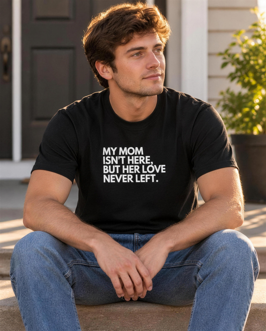 Man wearing the Her Love Never Left graphic tee on a porch