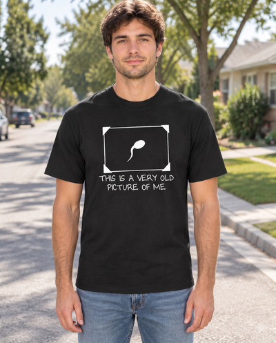 Man wearing the Very Old Picture of Me funny graphic tee on a sunny street