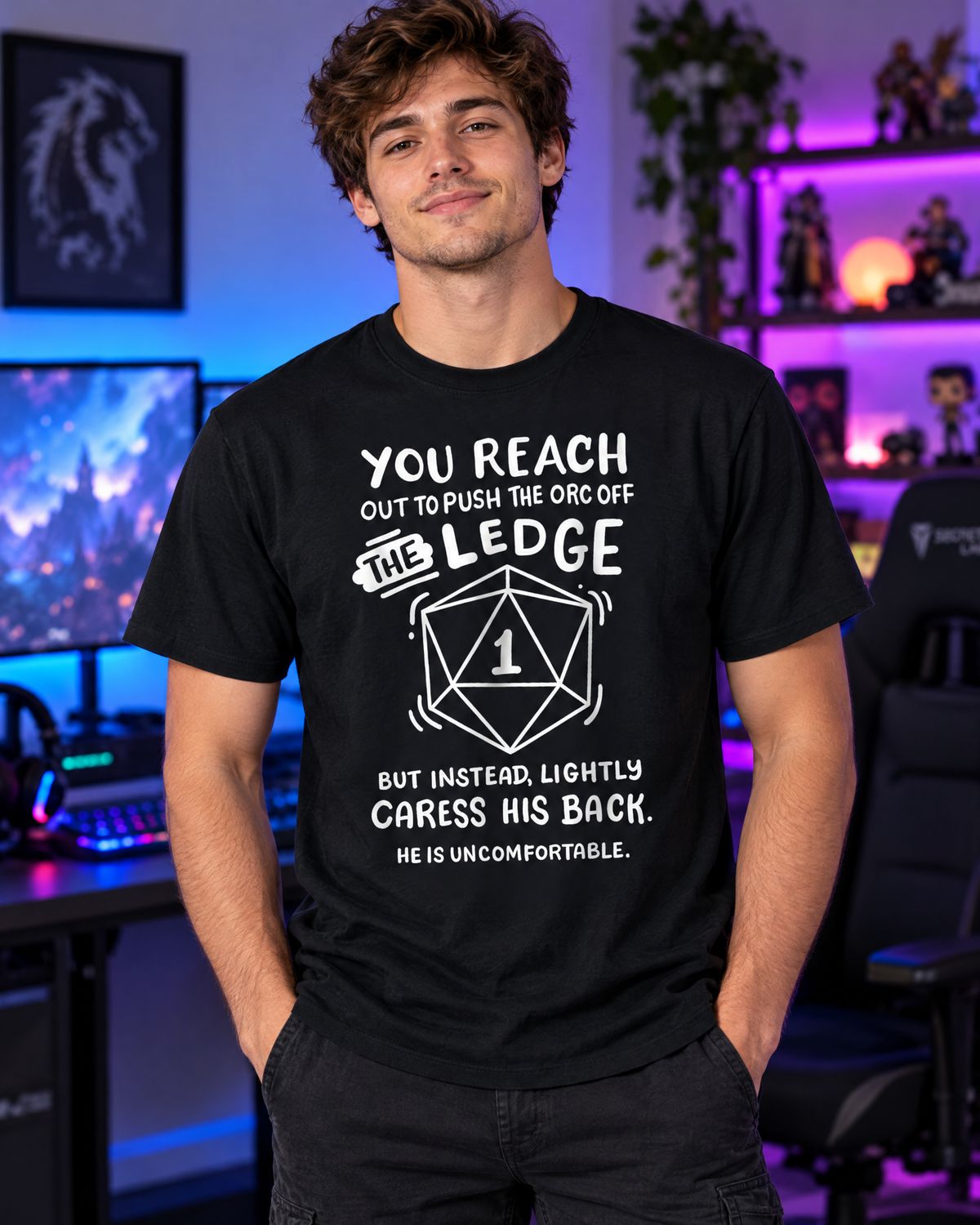 Young man wearing the RPG Gamer Orc funny graphic tee in a gaming room