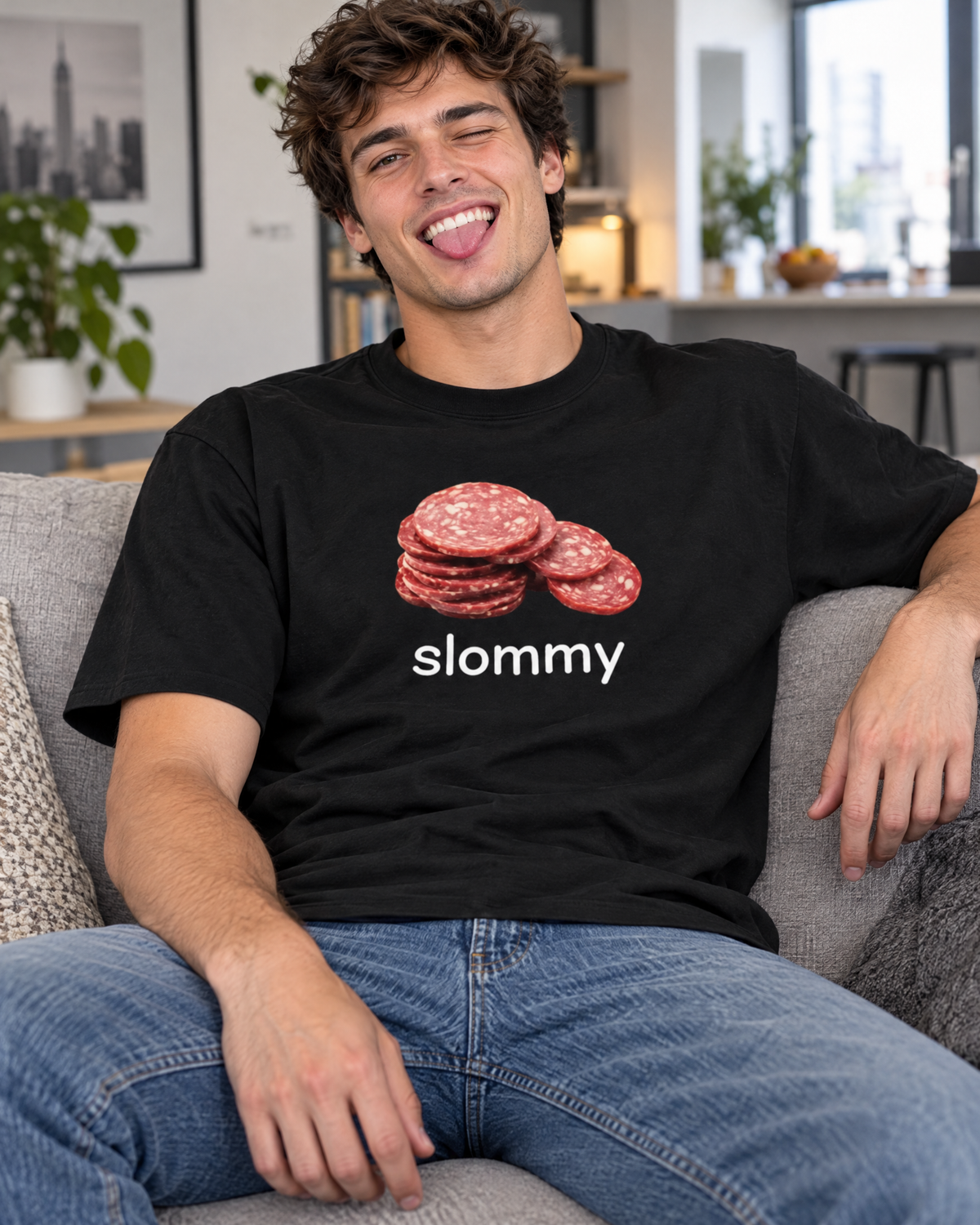 Man wearing the Slommy funny graphic tee relaxing on a couch