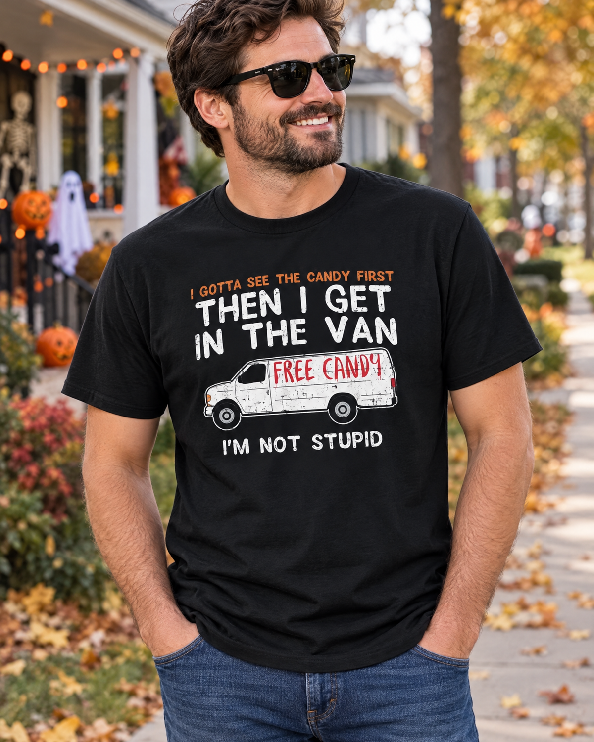 Man wearing the I Gotta See The Candy First funny graphic tee on an autumn street